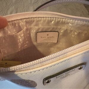 Pink Kate Spade crossbody bag with pink glitter polka dots